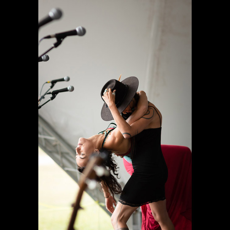 Leah and Chloe of Rising Appalachia take some time to dance while their bassist/guitarist David Brown and percussionist Biko Casini play on.