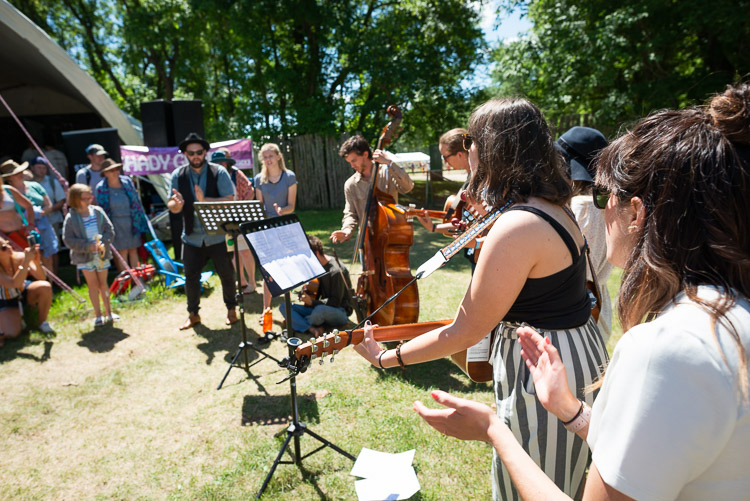 The Fortunate Ones teach their young performers the important art of taking the show to the grass to finish things off right when they ran out of stage time.