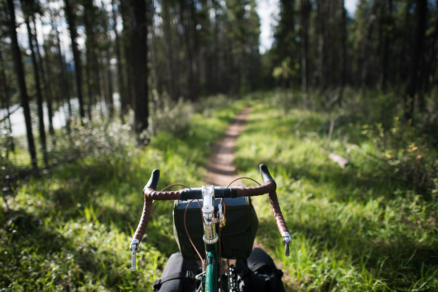 Venturing away from the road and into the backcountry. This section of path was scenic and fun, but it quickly turned gnarly for a fully loaded touring bike. Access to the camp destination is listed as an easy 14km return mountain bike trail that &ldquo;follows a well packed fire road that is easily traversed.&rdquo; Well let me tell you, if this was a fire road it must&rsquo;ve been so a very long time ago because there were narrow bridges, washed out swampy sections, overgrown parts, and some really steep hills riddled with a lot of sharp rocks and roots. It was a technical mountain bike ride made even more technical by being fully loaded (at the train station my gear weigh in was about 70 pounds - 25 pounds of food for this leg of the journey). But where there&rsquo;s a will, there&rsquo;s a way - I took it slowly and carefully, and made it to a beautiful campsite at the meeting of the Athabasca and Sunwapta rivers. I only almost died twice (exaggerating a little&hellip;but only a little).