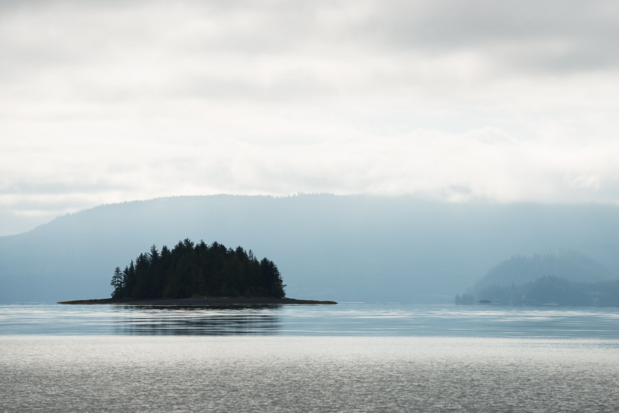 Fog clears and first glimpses of the long sought after Haida Gwaii come into view.