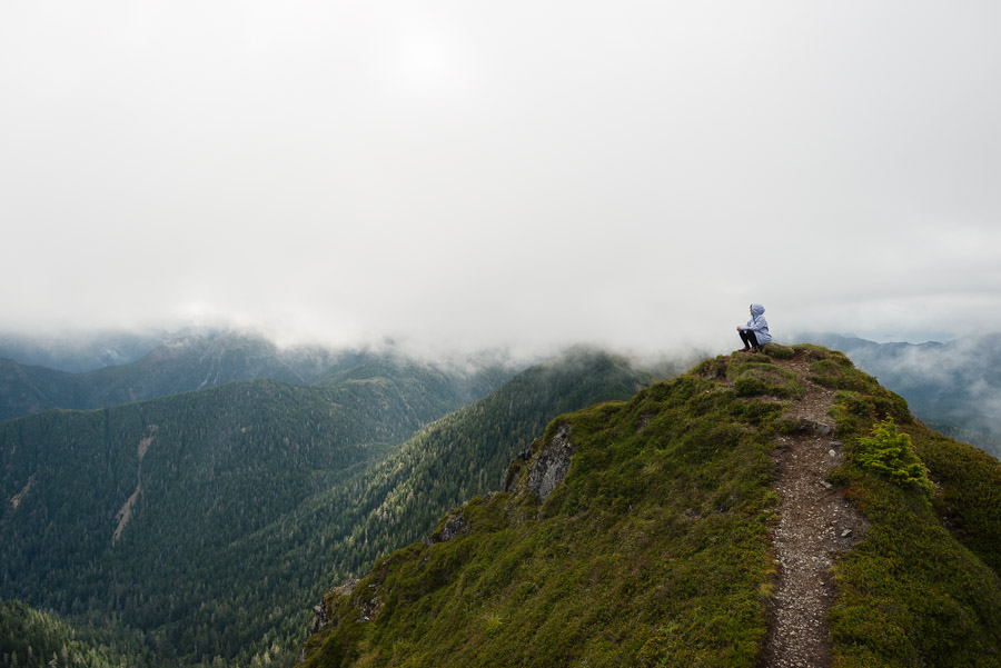 700 meters of steep elevation beyond the trailhead, we climb to the peak of Mount Genevieve at the end of the Sleeping Beauty Trail. It was a duathlon of sorts to reach this spot, but it was worth it. As our warm and tired muscles were soothed by the cool mist swirling around us, we stopped to enjoy the view and bask in its magnificence. It was one of those moments that really make you feel alive; enjoying the realization that your own perseverance and strength got you to this place is one of greatest rewards of traveling.