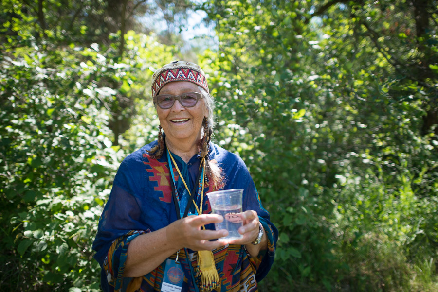 Elder Mae Louise Campbell welcomes artists and visitors alike to the festival with a traditional water ceremony.