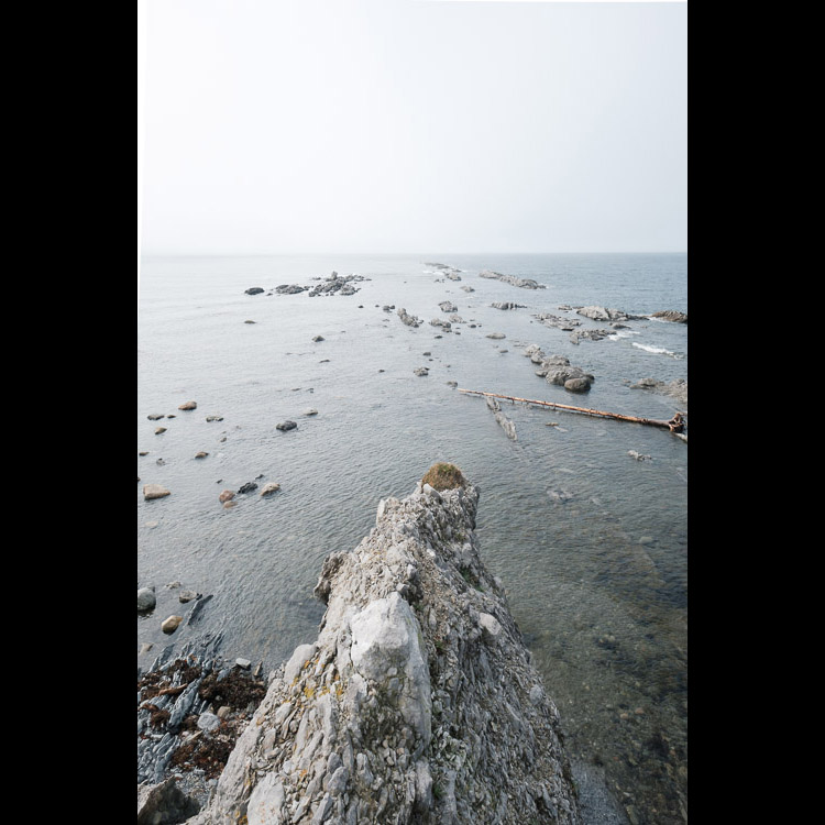 A rocky point fades into the distance.