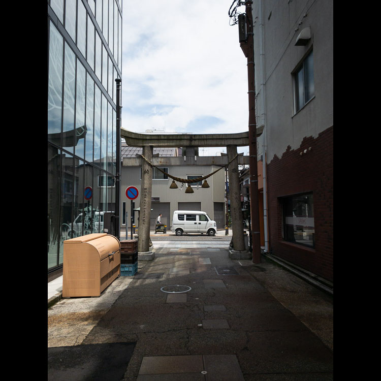 This stone gate is known as a torii and it is a powerful symbol repeated throughout Japan. It marks the transition from the mundane to the sacred and serves as a reminder that one is treading on ground with deep spiritual meaning - even in the heart of the city where the earth has been covered in pavement.