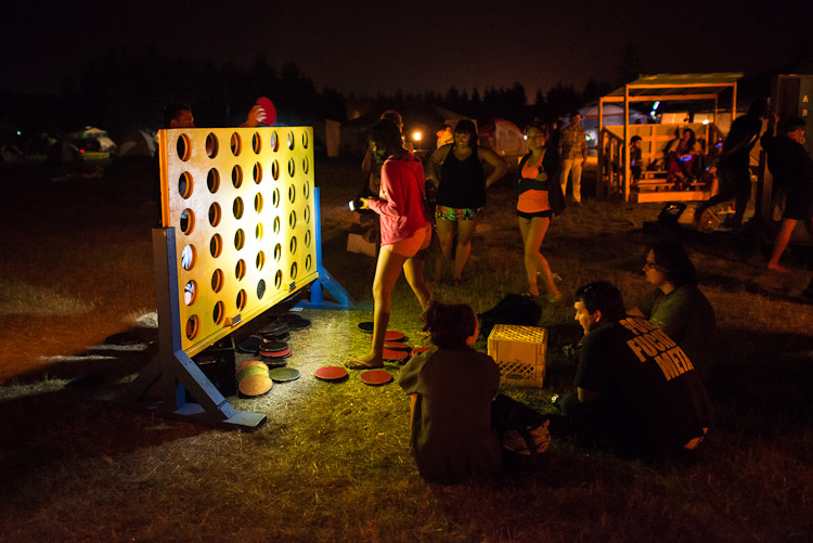 A couple plays a game of Connect Four at Big Games in the festival campground.