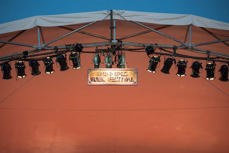 The iconic Winnipeg Folk Festival sign dangles above Main Stage.
